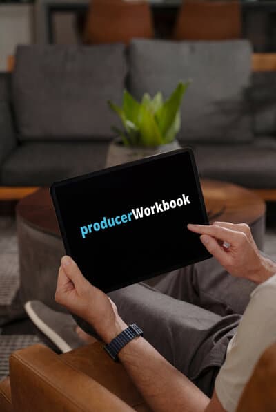 A person holding a tablet where the Producer Workbook logo is displayed